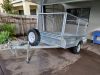 8x5 single axle braked trailer, 900mm cage & canvas cover